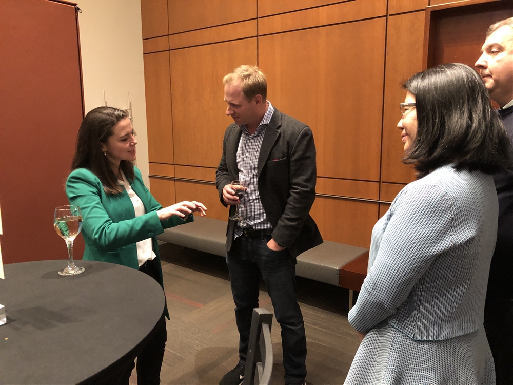 Speaker Julia Dhar talks to Sandstone guests.