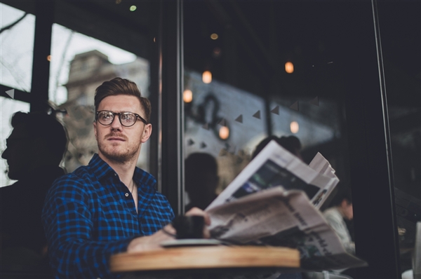 Curious man thinking about the news